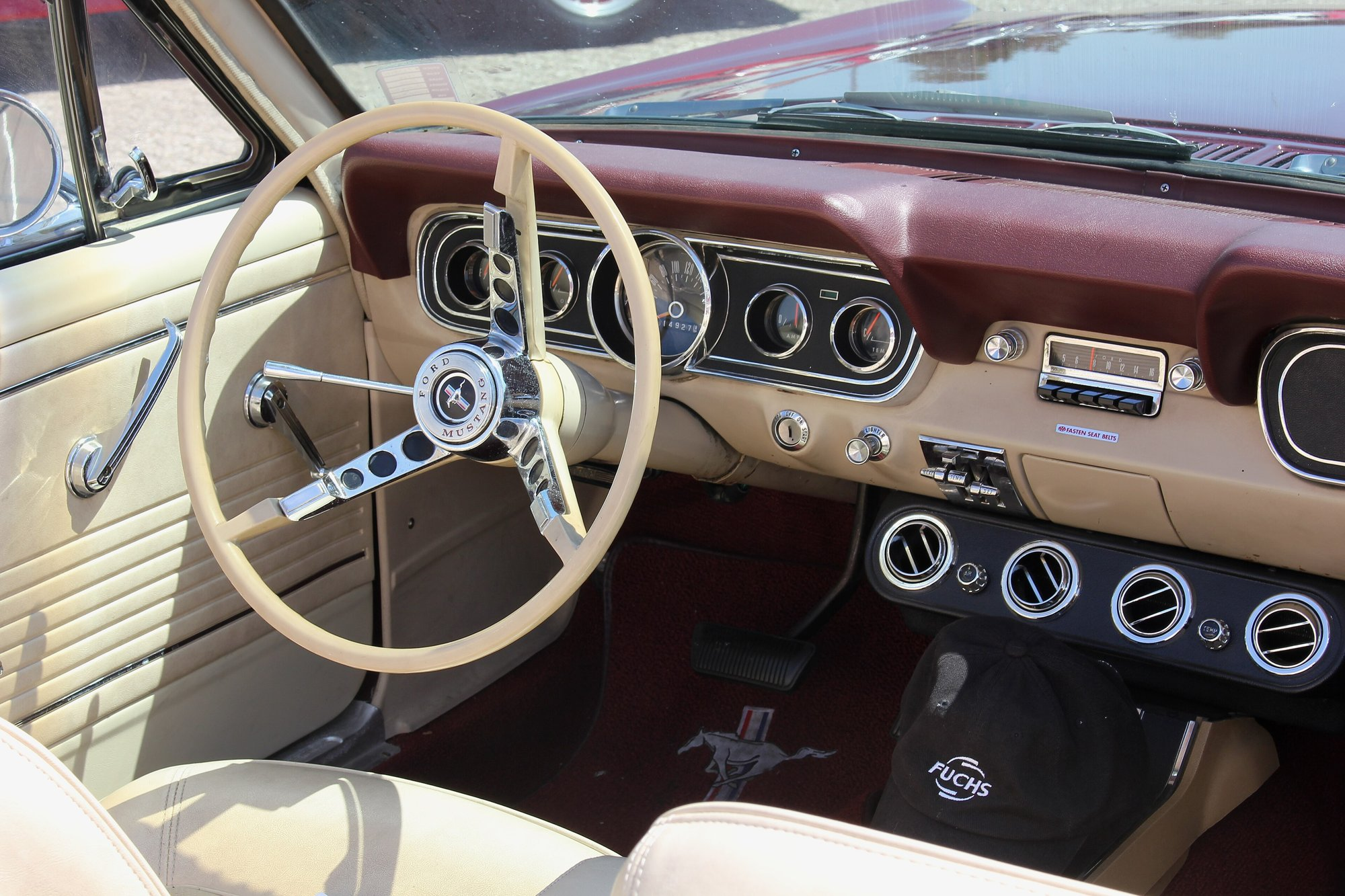 1966 Ford Mustang interior with the steering wheel and five-pod instrument cluster including the speedometer