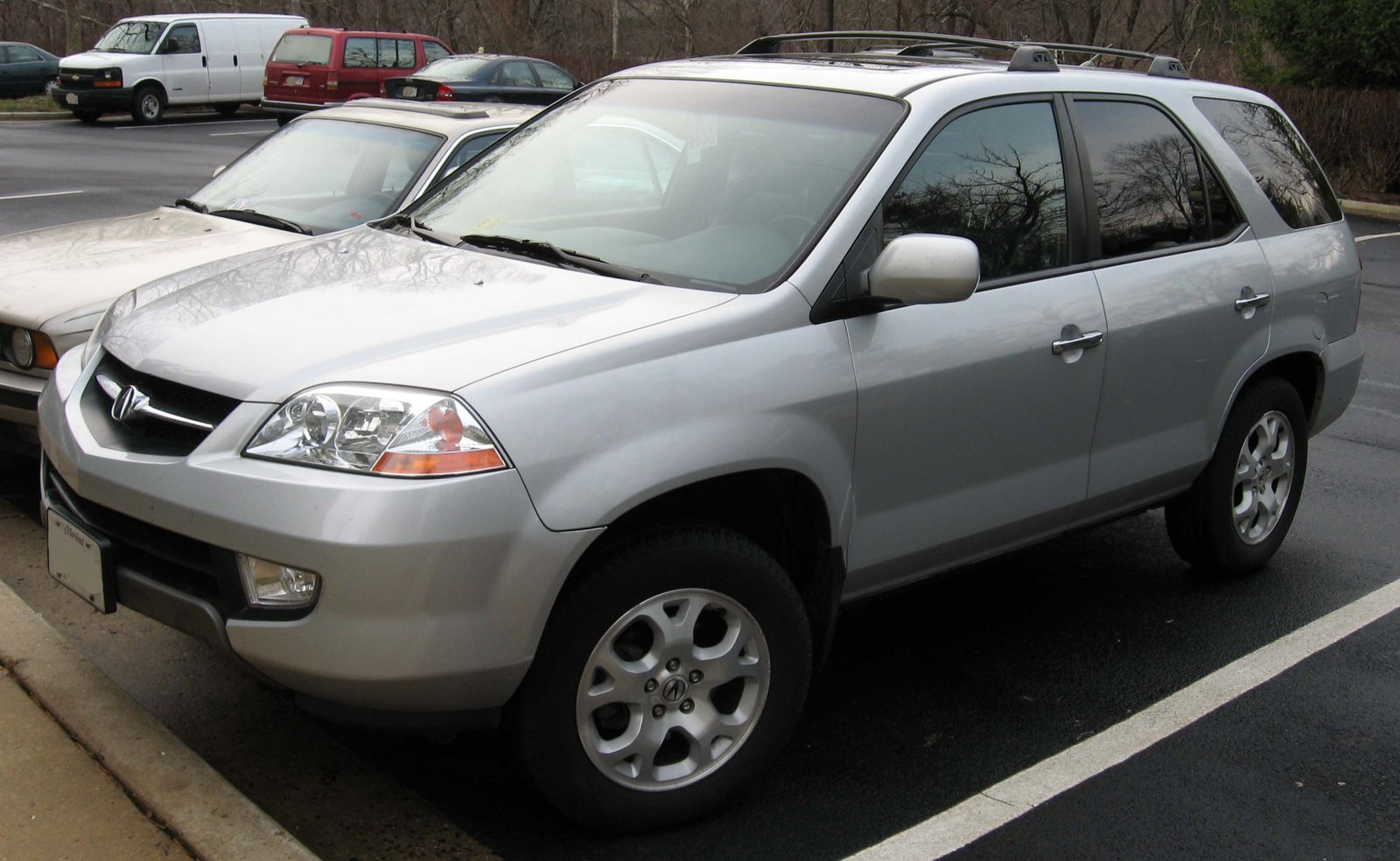 Silver 2001-2003 Acura MDX SUV parked in a lot, first generation model