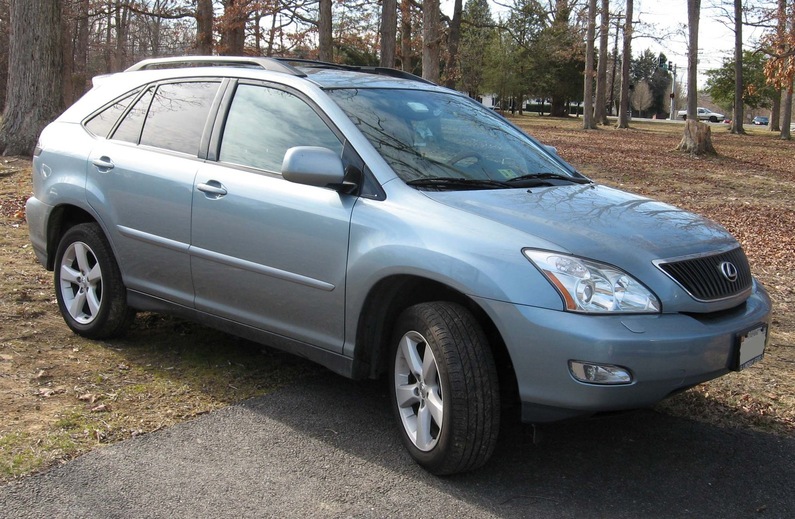 Light blue Lexus RX 330 parked on a driveway, front three-quarter view