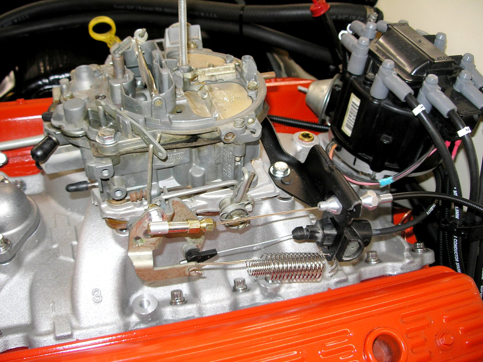 Rochester Quadrajet four-barrel carburetor and throttle linkage on a small-block Chevrolet V8